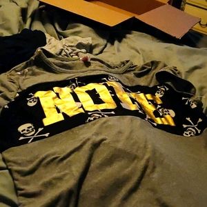 Grey and black shirt sleeve with white skulls